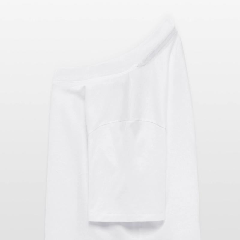 an explorer standing on a rock with a tent